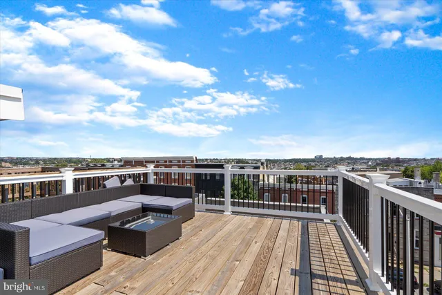 a view of roof deck with patio