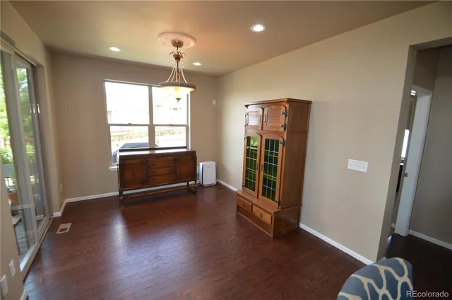 a view of livingroom with furniture wooden floor and window