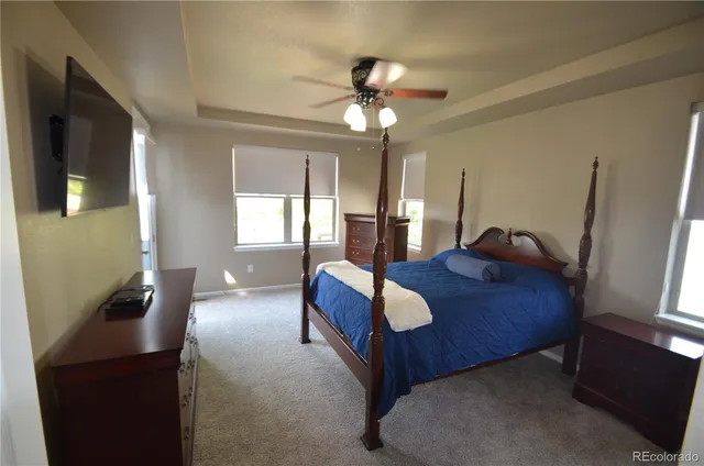 a bed room with a bed and a chandelier