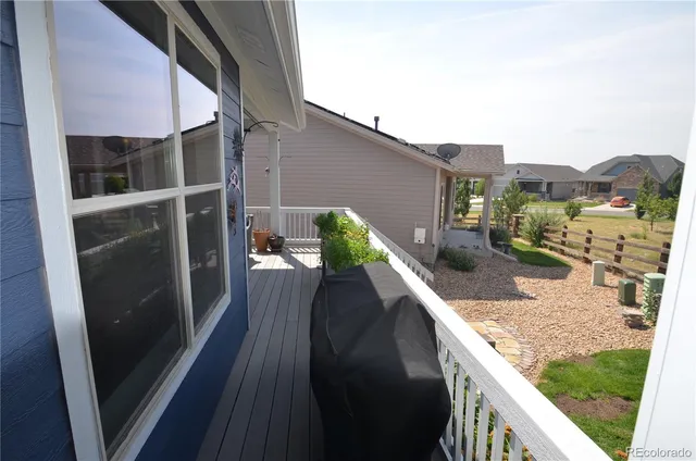a view of balcony with furniture