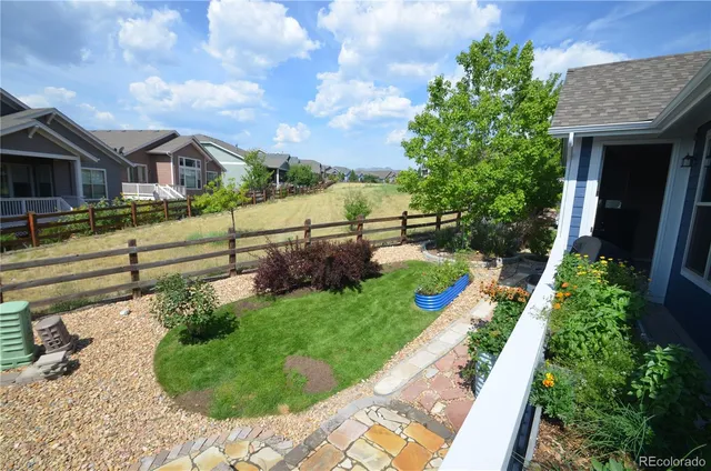 a building outdoor space with patio furniture and potted plants