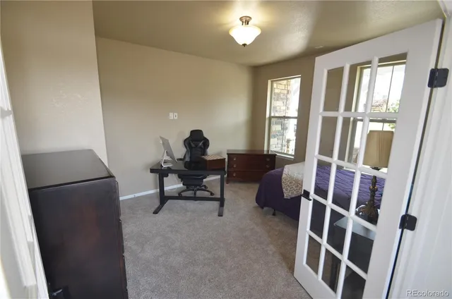 a view of a livingroom with furniture and windows
