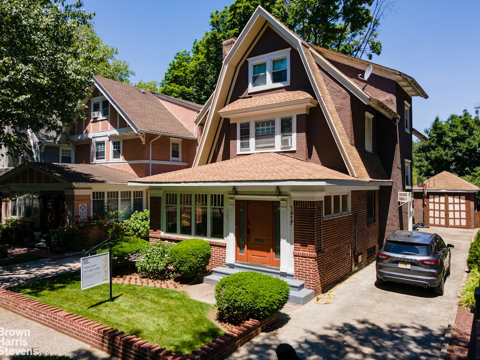 1917 Glenwood Road Brooklyn, NY 11230 - Photo 1 of 22 a front view of a house with a yard
