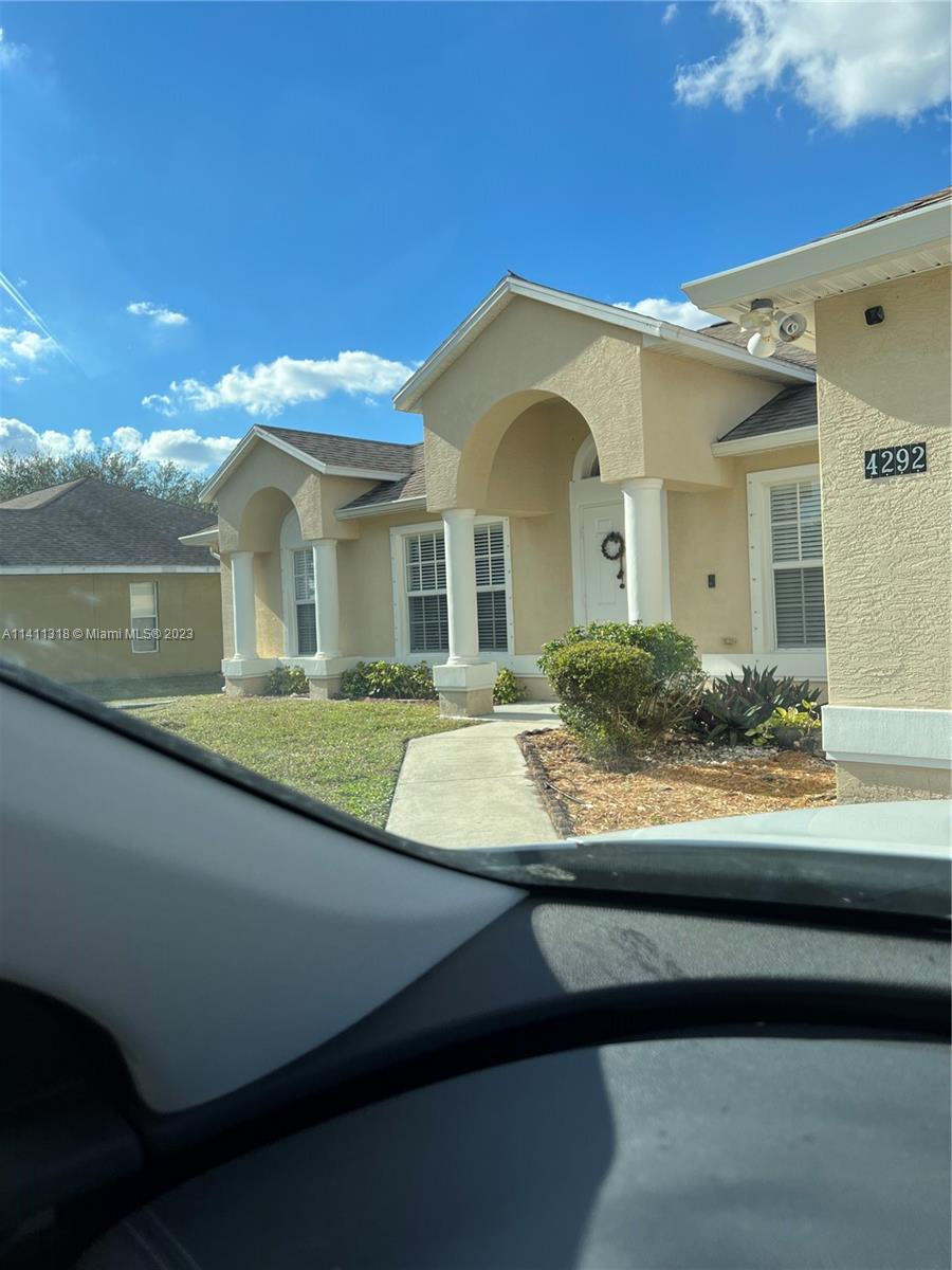 a front view of a house with yard