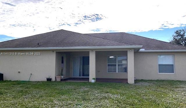 4292 Southwest Paley Road Port St. Lucie, FL 34953 - Photo 17 of 21 a house view with a garden space