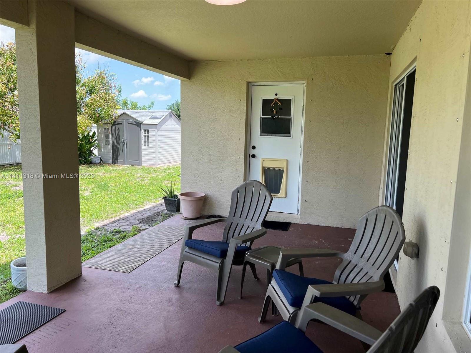 4292 Southwest Paley Road Port St. Lucie, FL 34953 - Photo 18 of 21 a view of a room with a table and chairs