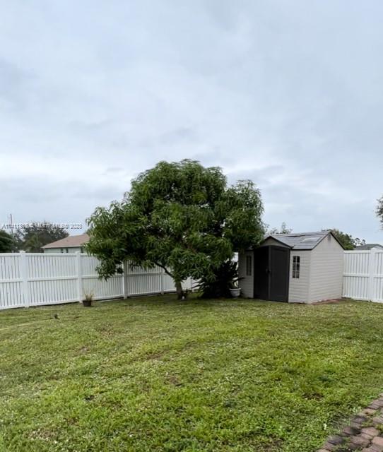 4292 Southwest Paley Road Port St. Lucie, FL 34953 - Photo 20 of 21 a view of a house with a yard and sitting area