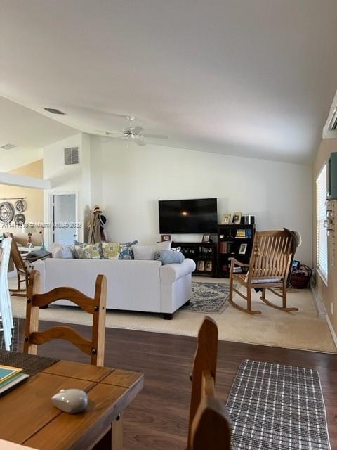 4292 Southwest Paley Road Port St. Lucie, FL 34953 - Photo 7 of 21 a living room with furniture and a flat screen tv with wooden floor