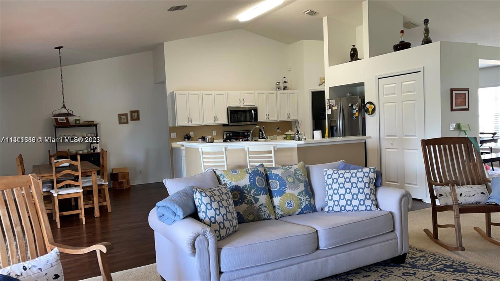 4292 Southwest Paley Road Port St. Lucie, FL 34953 - Photo 8 of 21 a living room with furniture and a flat screen tv
