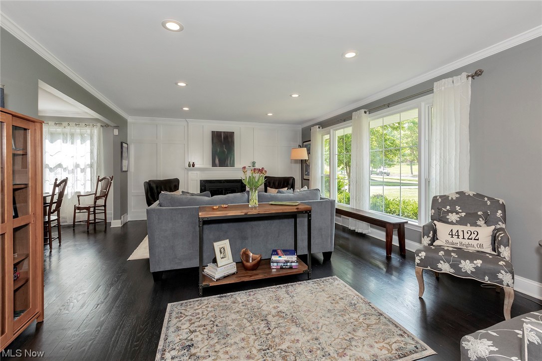 24101 Hazelmere Road Beachwood, OH 44122 - Photo 2 of 25 Bright living room, with a grand picture window and gas burning fireplace to keep you comfortable and enjoying our winters.