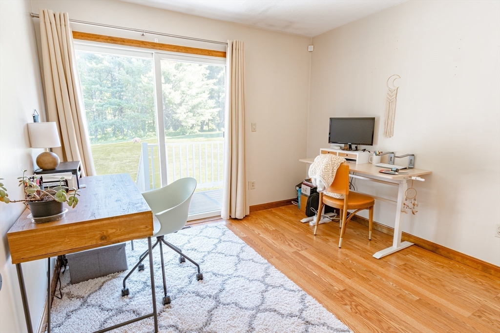 27 Comins Road North Oxford, MA 01537 - Photo 17 of 32 a view of a workspace with furniture and a window