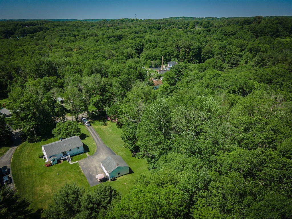 27 Comins Road North Oxford, MA 01537 - Photo 4 of 32 an aerial view of a house with a yard