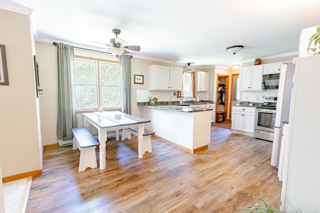 27 Comins Road North Oxford, MA 01537 - Photo 7 of 32 a living room with stainless steel appliances granite countertop furniture wooden floor and a kitchen view