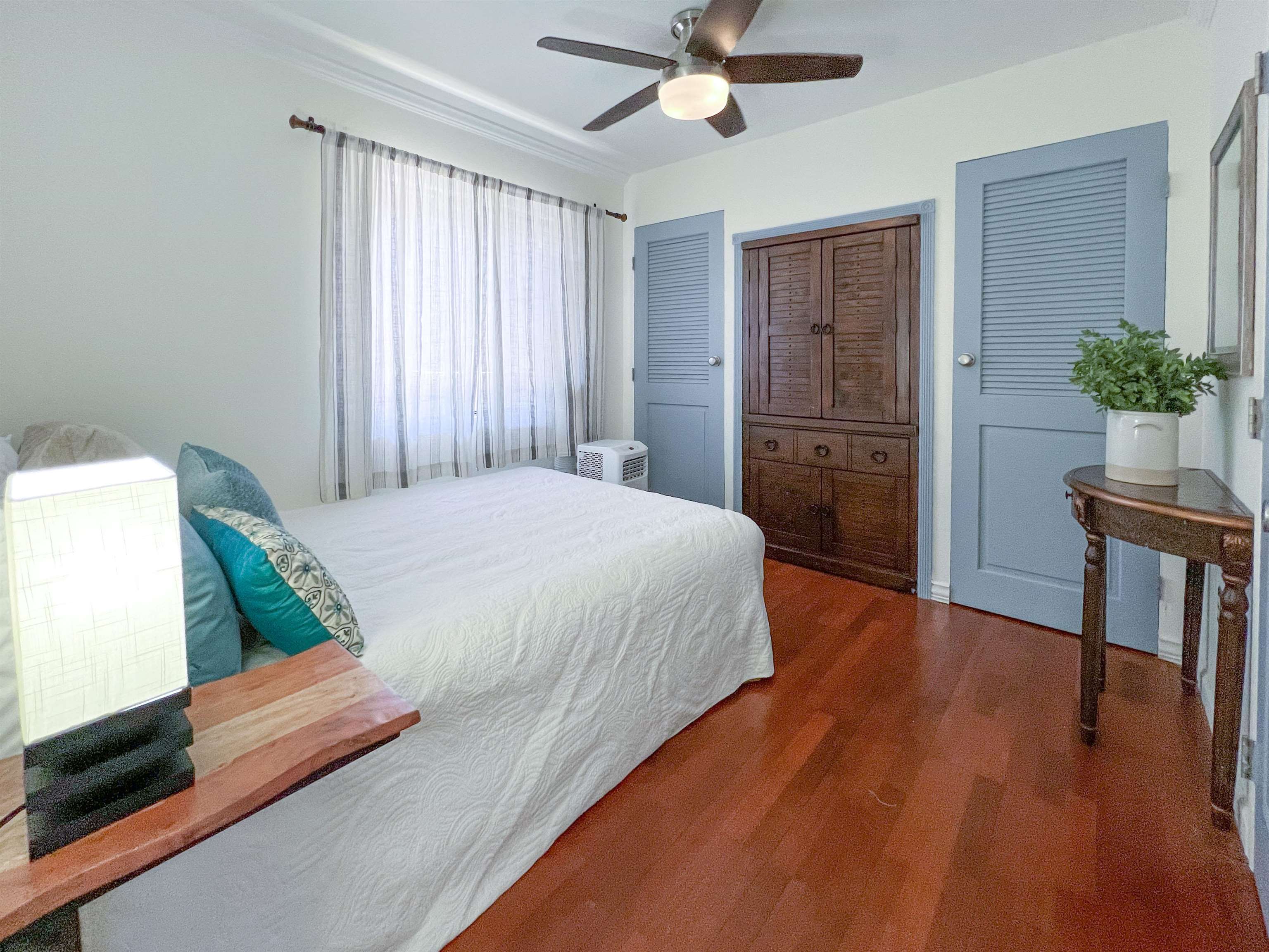 2219 South Kihei Road, Unit A314 Kihei, HI 96753 - Photo 11 of 20 a bedroom with a bed and a potted plant
