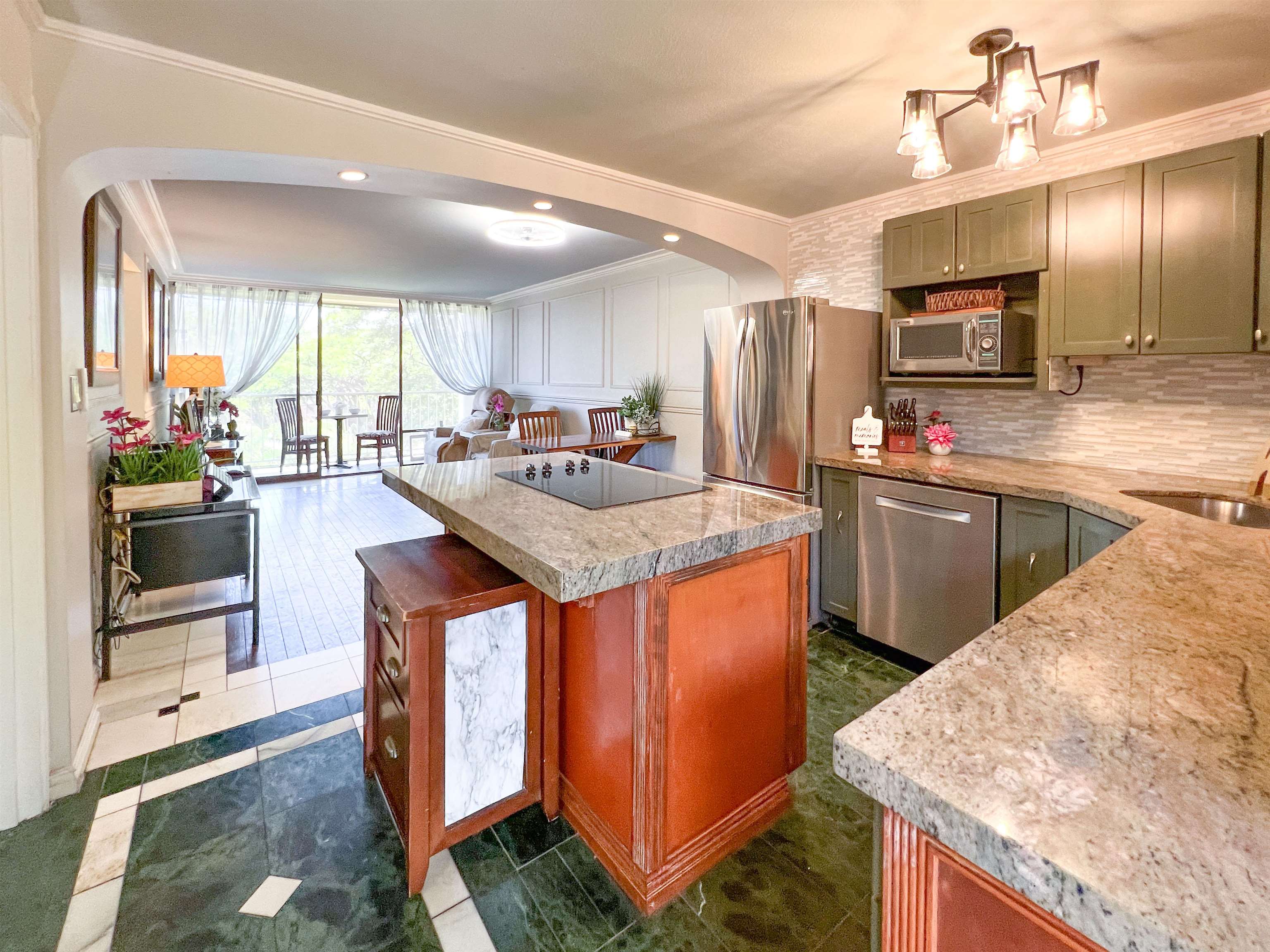 2219 South Kihei Road, Unit A314 Kihei, HI 96753 - Photo 2 of 20 a kitchen with stainless steel appliances granite countertop a stove a sink and a refrigerator