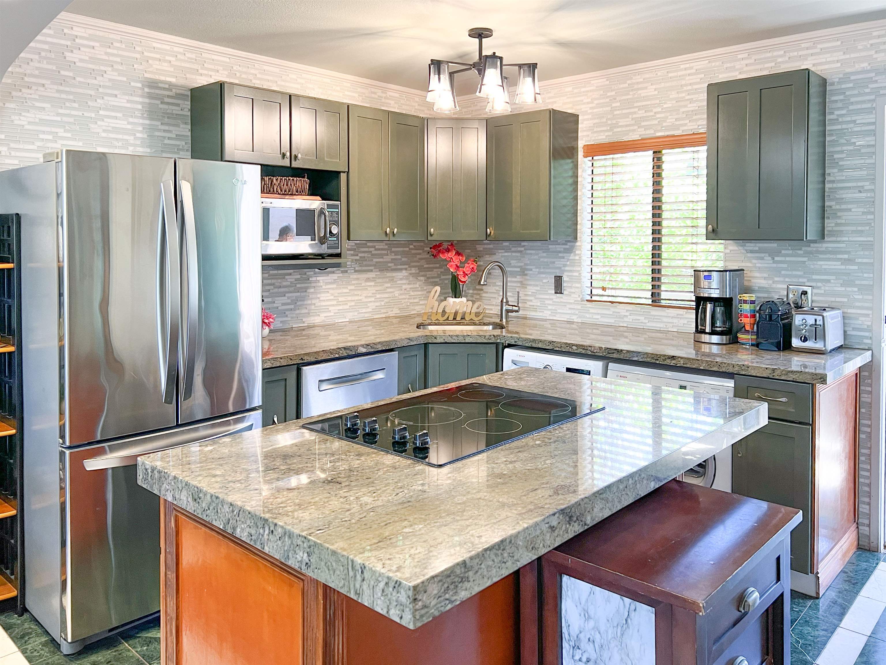 2219 South Kihei Road, Unit A314 Kihei, HI 96753 - Photo 3 of 20 a kitchen with granite countertop a sink and refrigerator