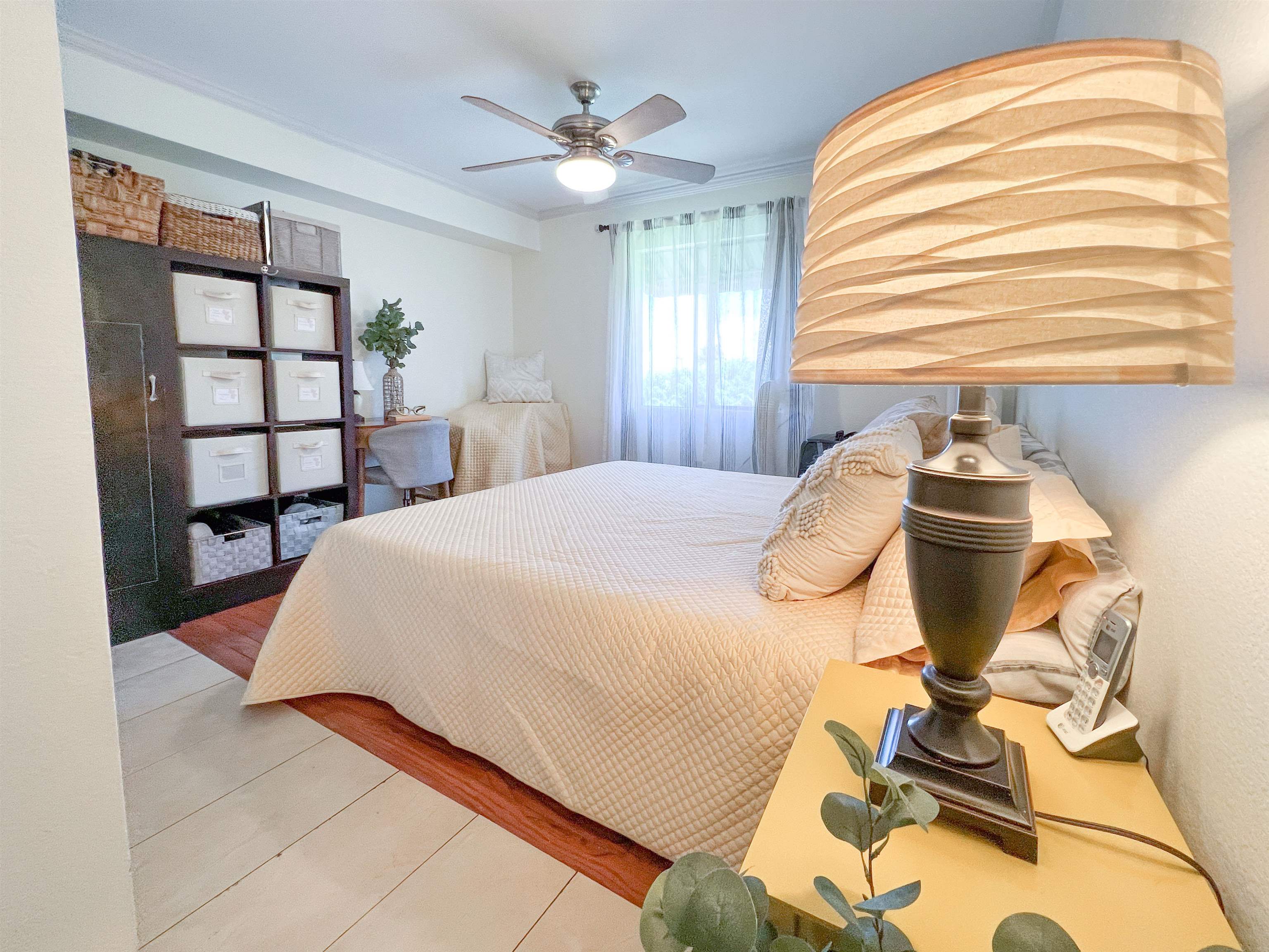 2219 South Kihei Road, Unit A314 Kihei, HI 96753 - Photo 8 of 20 a bedroom with a bed and window