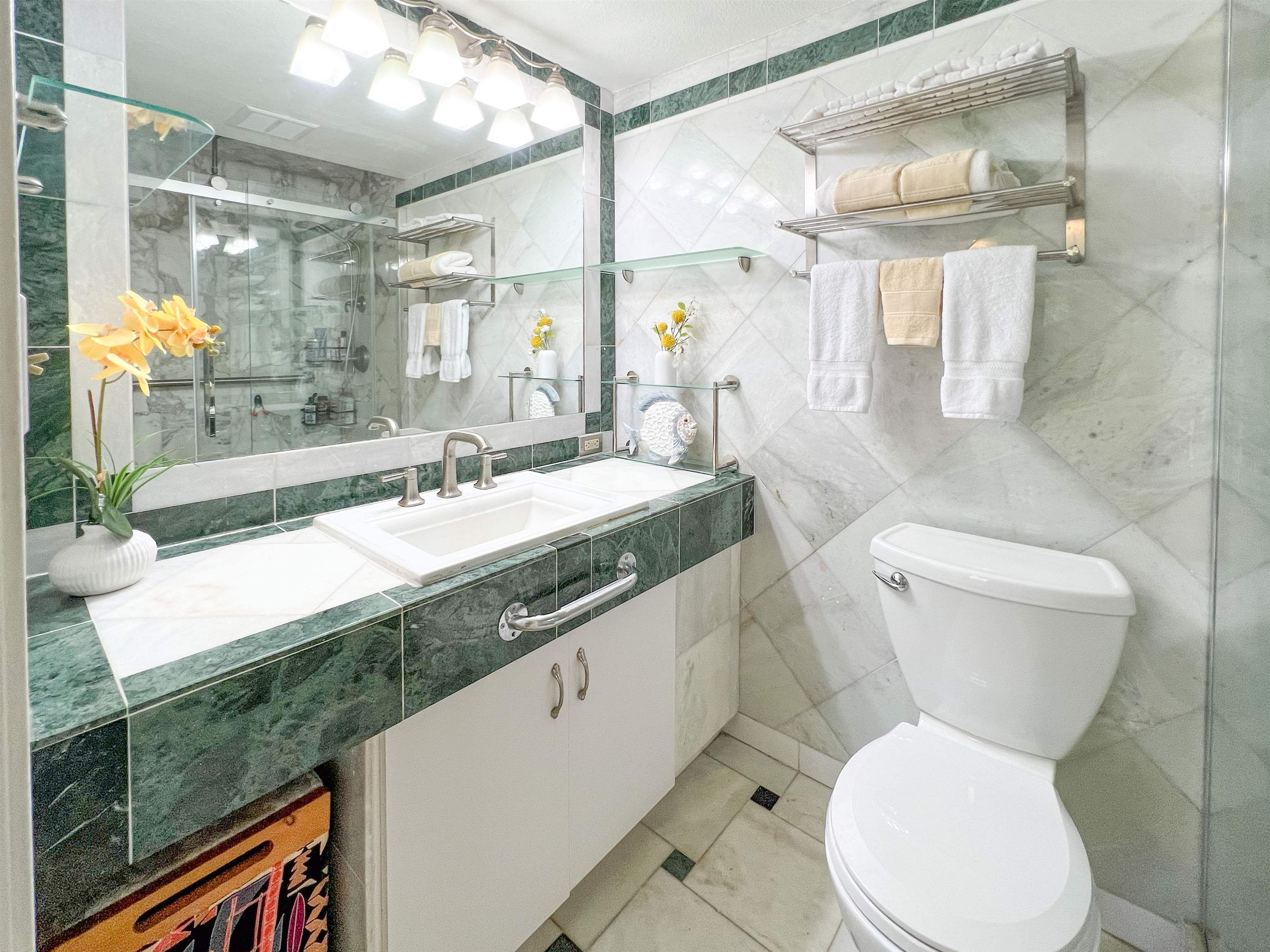 2219 South Kihei Road, Unit A314 Kihei, HI 96753 - Photo 10 of 20 a bathroom with a granite countertop toilet a sink and a mirror