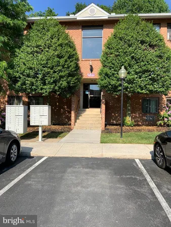 a building with trees in front of it