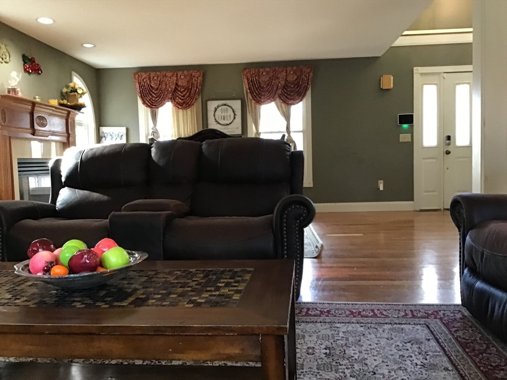 299 Three Rivers Road Wilbraham, MA 01095 - Photo 17 of 32 a living room with furniture and a potted plant