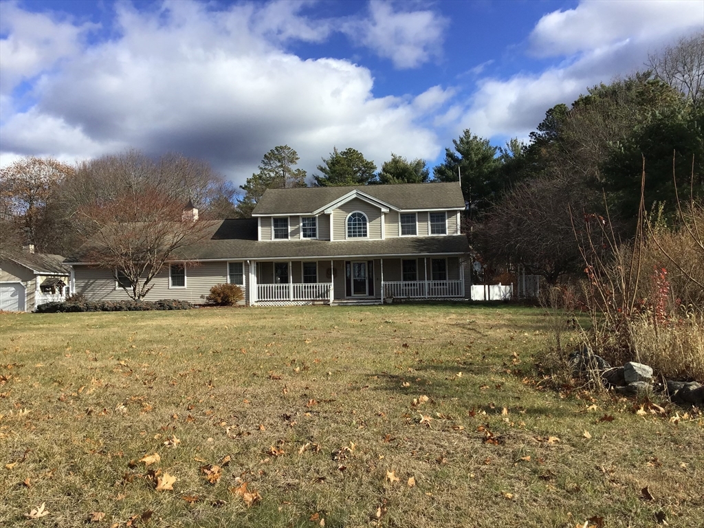 299 Three Rivers Road Wilbraham, MA 01095 - Photo 2 of 32 a front view of a house with a garden