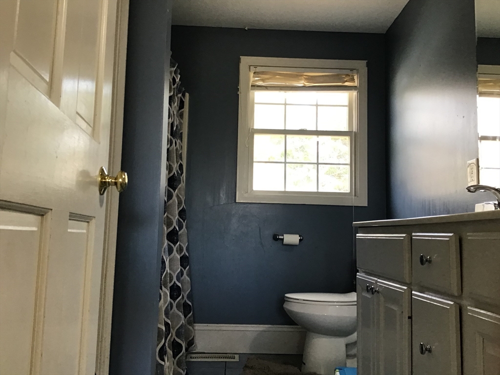 299 Three Rivers Road Wilbraham, MA 01095 - Photo 23 of 32 a bathroom with a toilet and a sink