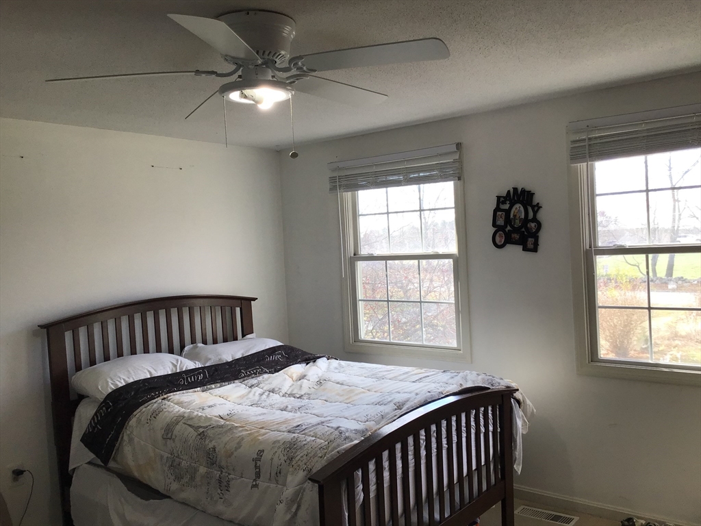 299 Three Rivers Road Wilbraham, MA 01095 - Photo 28 of 32 a bedroom with bed and window
