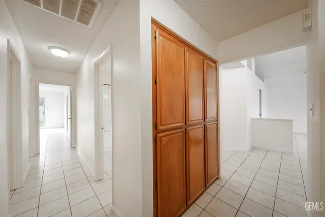 a view of a closet area with living room