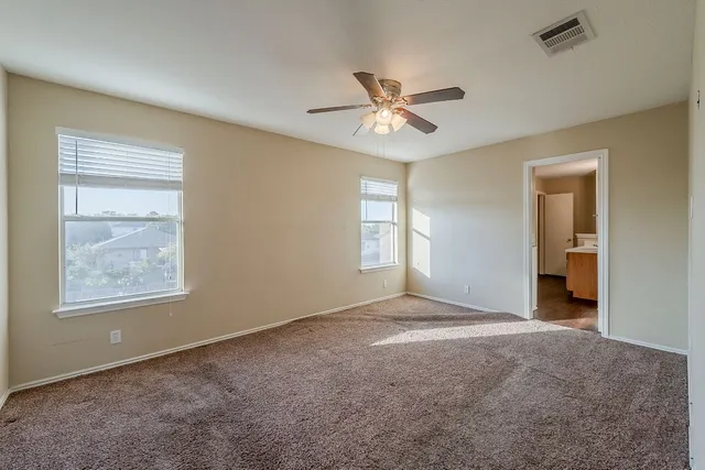 a view of empty room with windows