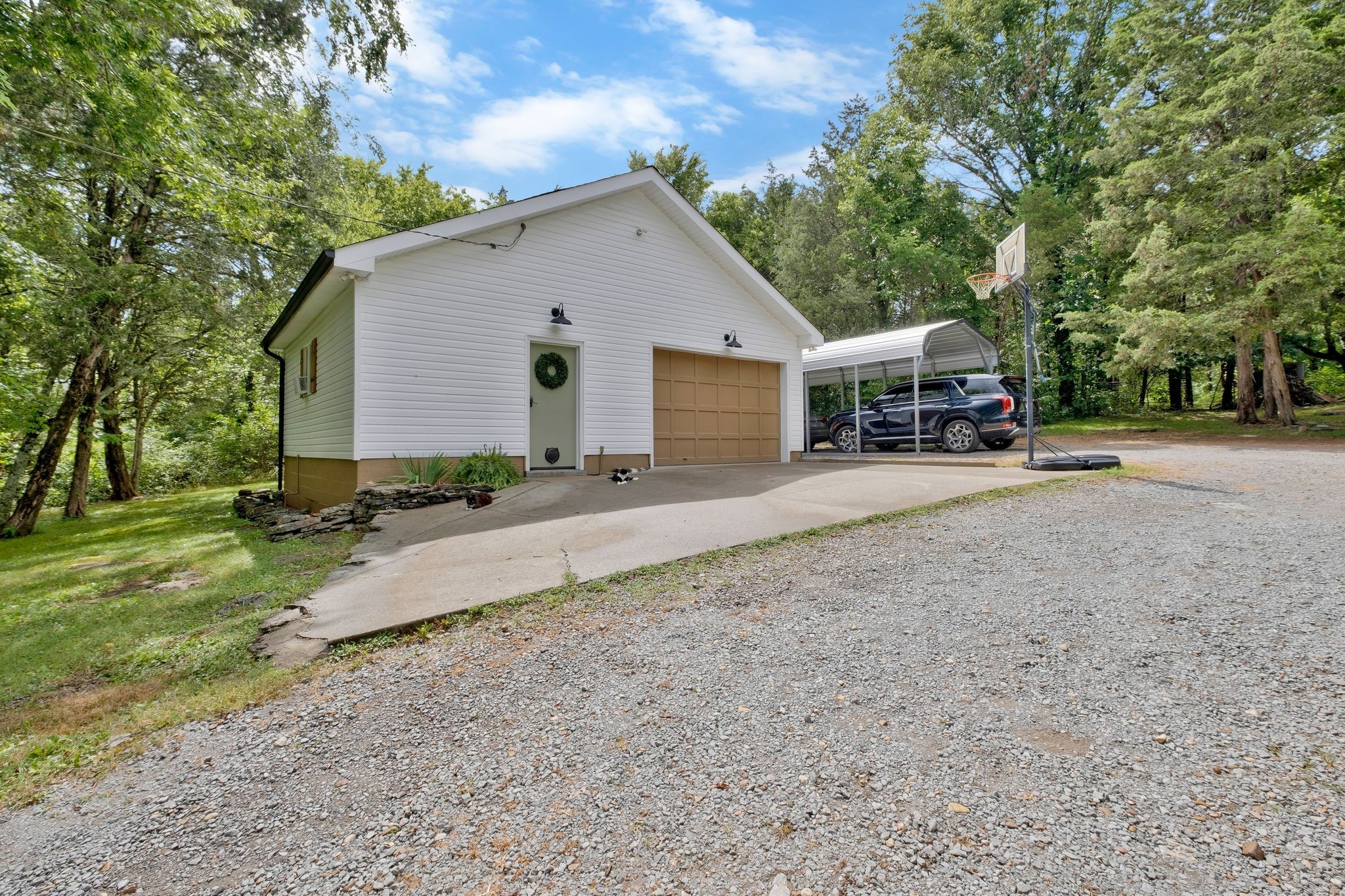 345 Lock 5 Road Lebanon, TN 37087 - Photo 34 of 50 Garage with extra space for hobbies, pets and extra toys! Heated and cooled. Extra carport will cover two vehicles.