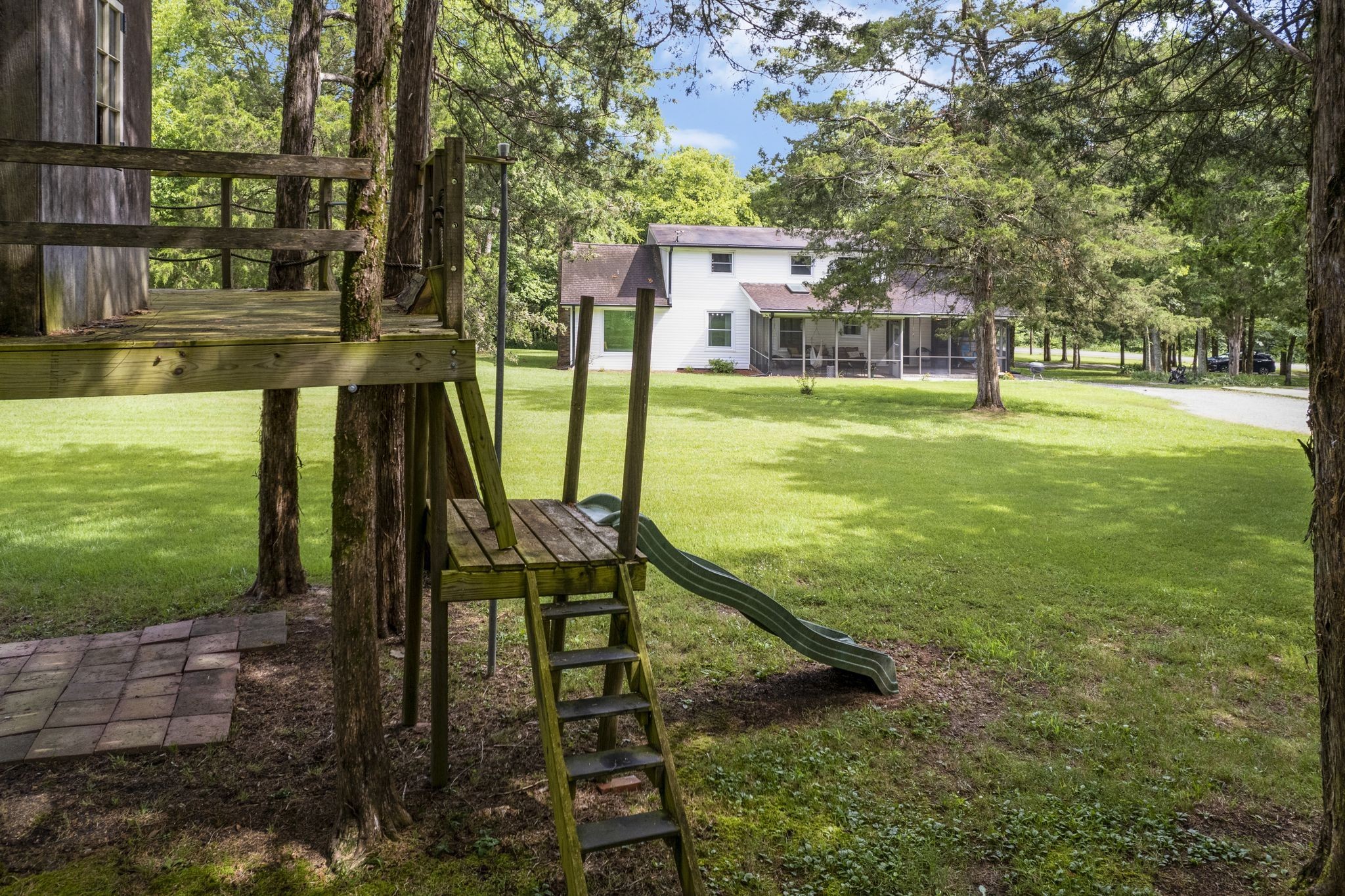 345 Lock 5 Road Lebanon, TN 37087 - Photo 41 of 50 Play treehouse/fort and climbing wall with slide in the back yard.
