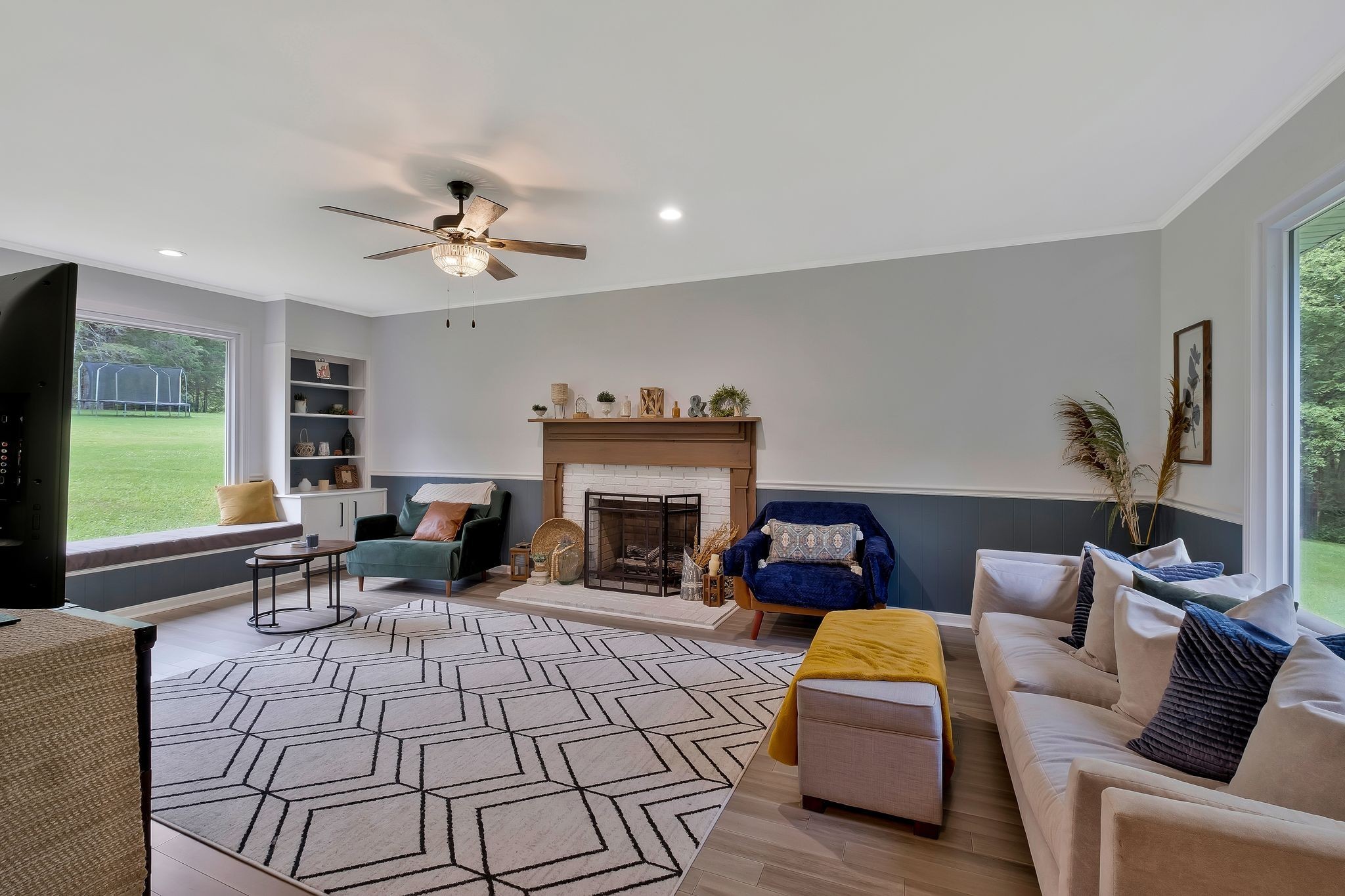 345 Lock 5 Road Lebanon, TN 37087 - Photo 8 of 50 Large picture windows in Living room. The mantel came from a 150 year old house and is put together with square nails.