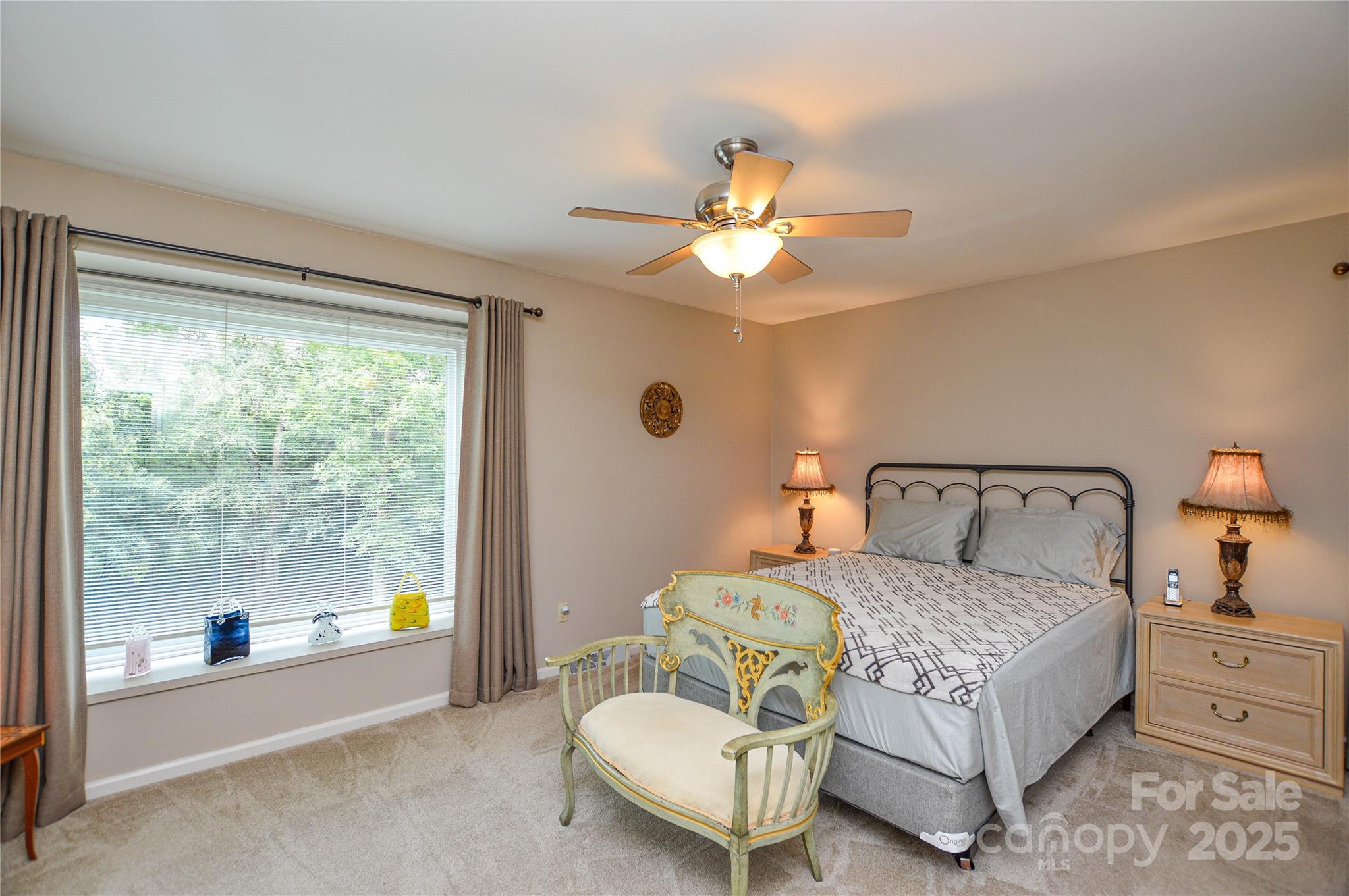 230 Ravine Circle Southeast Concord, NC 28025 - Photo 16 of 25 a bedroom with a bed and a chandelier