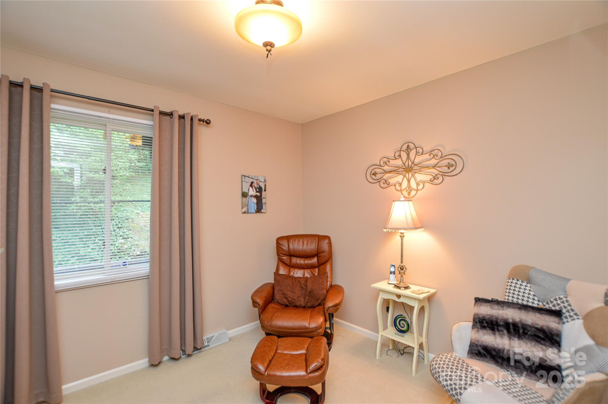 230 Ravine Circle Southeast Concord, NC 28025 - Photo 19 of 25 a room with furniture and a window