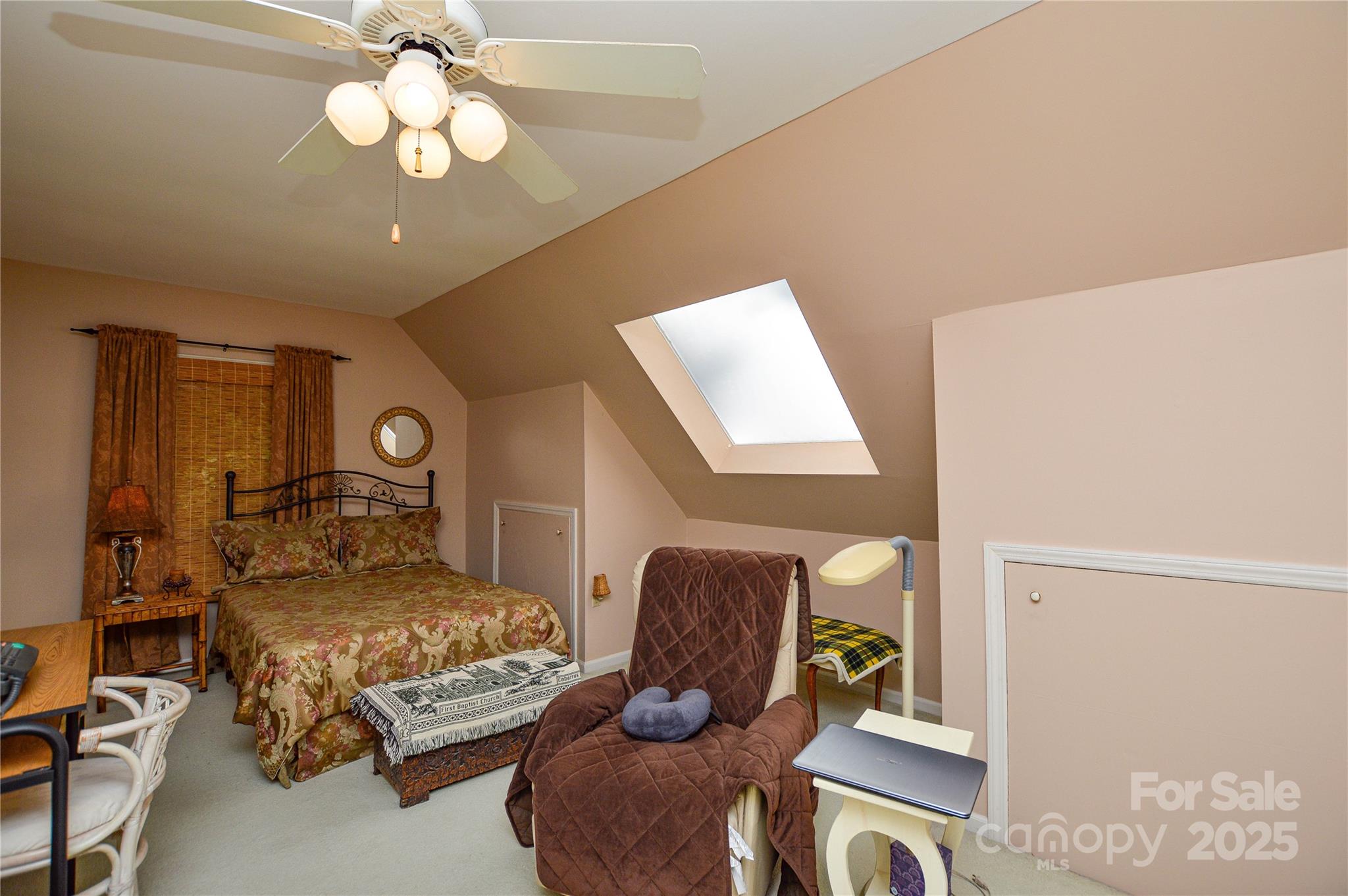 230 Ravine Circle Southeast Concord, NC 28025 - Photo 23 of 25 a bedroom with furniture and a chandelier