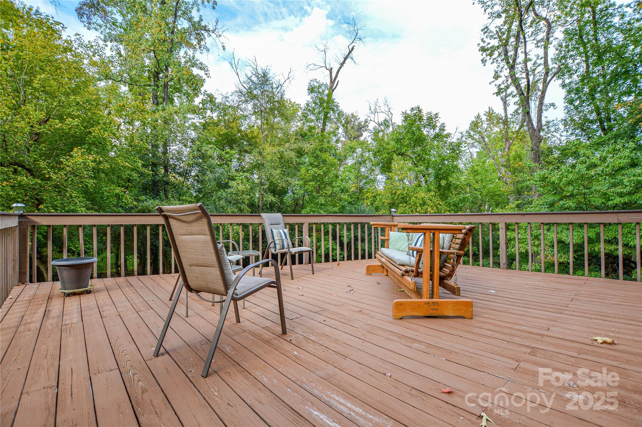 230 Ravine Circle Southeast Concord, NC 28025 - Photo 4 of 25 a view of a deck with wooden floor and fence