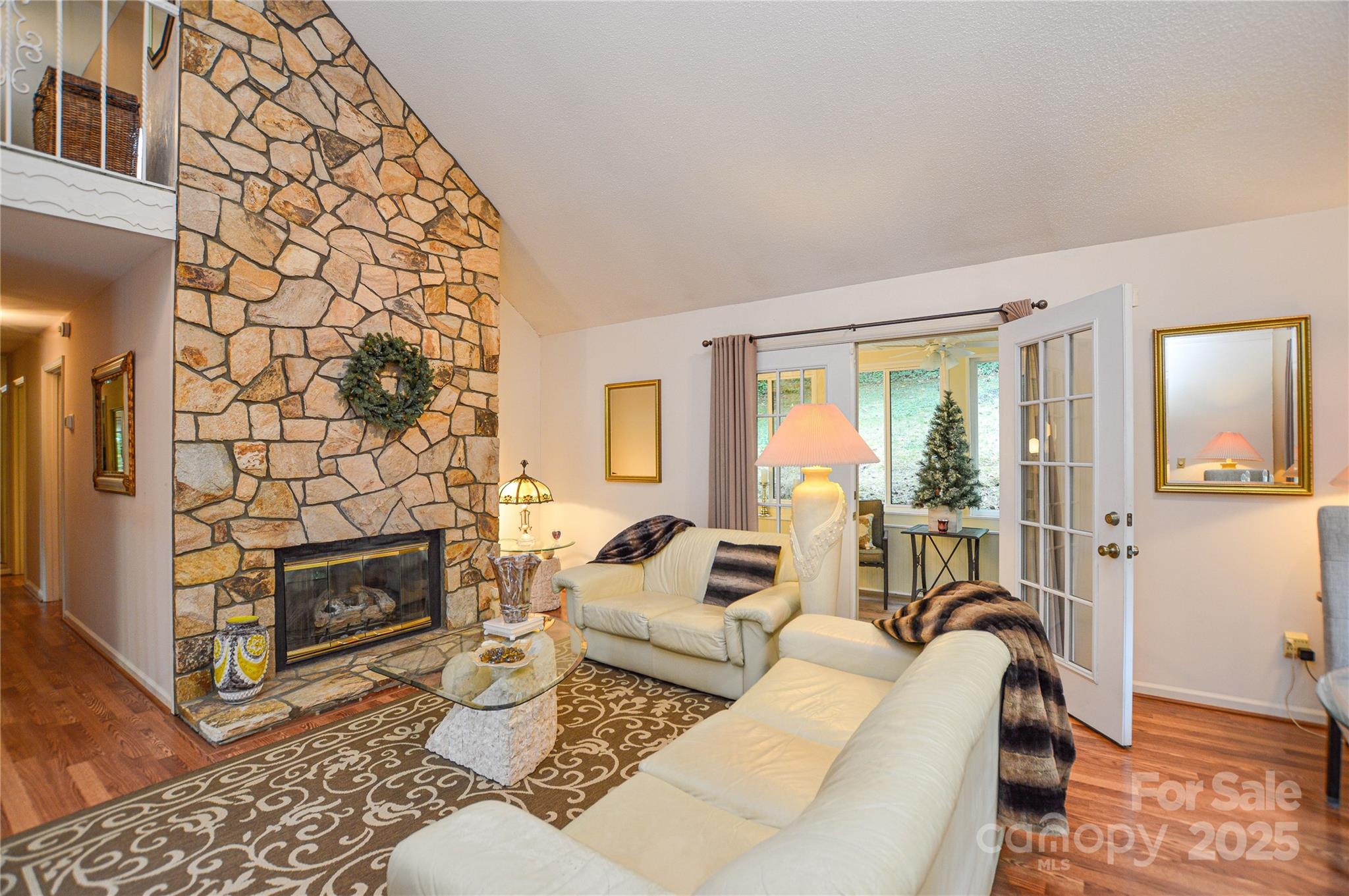 230 Ravine Circle Southeast Concord, NC 28025 - Photo 10 of 25 a living room with furniture a fireplace and a floor to ceiling window