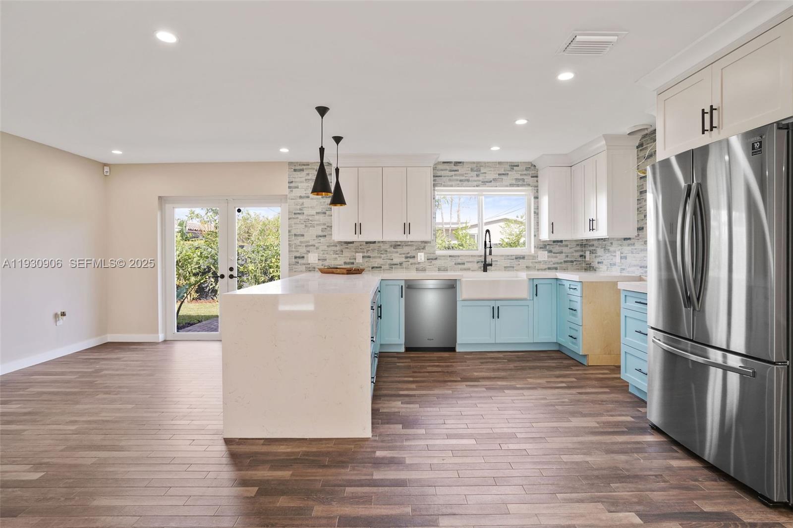 6701 Southwest 49th Terrace Miami, FL 33155 - Photo 14 of 35 a kitchen with a refrigerator a sink and cabinets