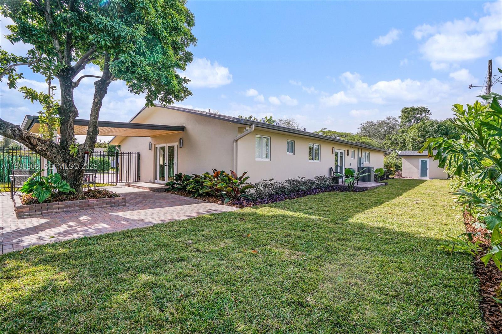 6701 Southwest 49th Terrace Miami, FL 33155 - Photo 21 of 35 a view of house with outdoor space and garden