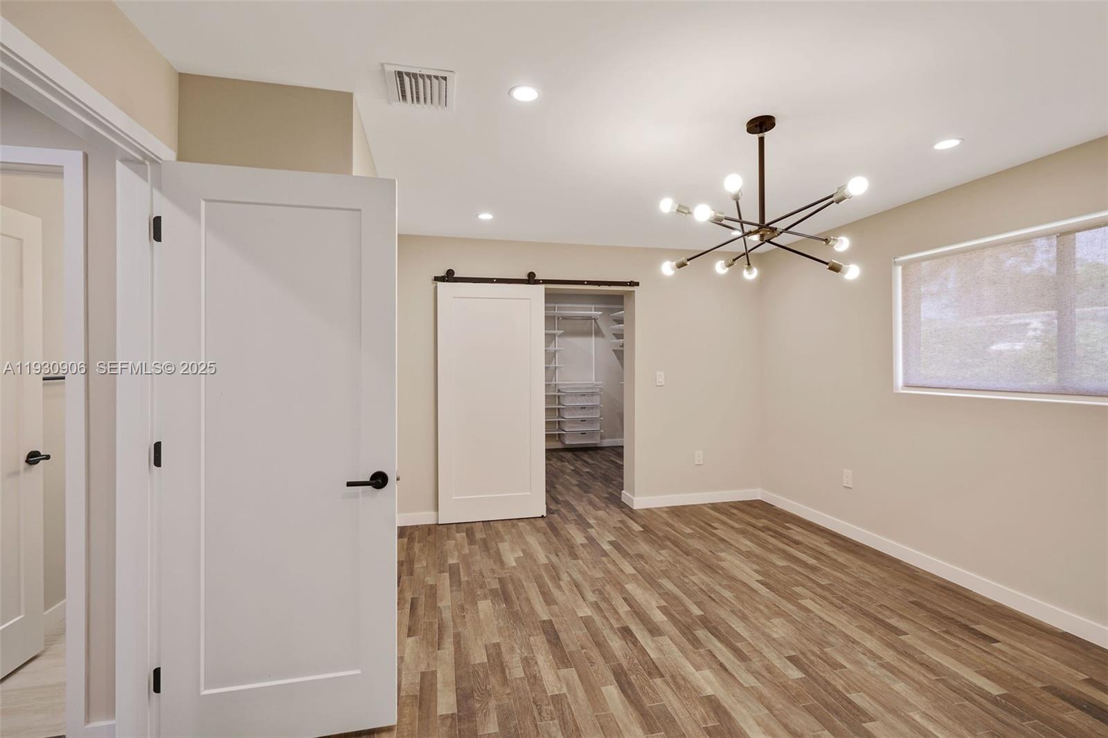 6701 Southwest 49th Terrace Miami, FL 33155 - Photo 24 of 35 wooden floor in an empty room with a window