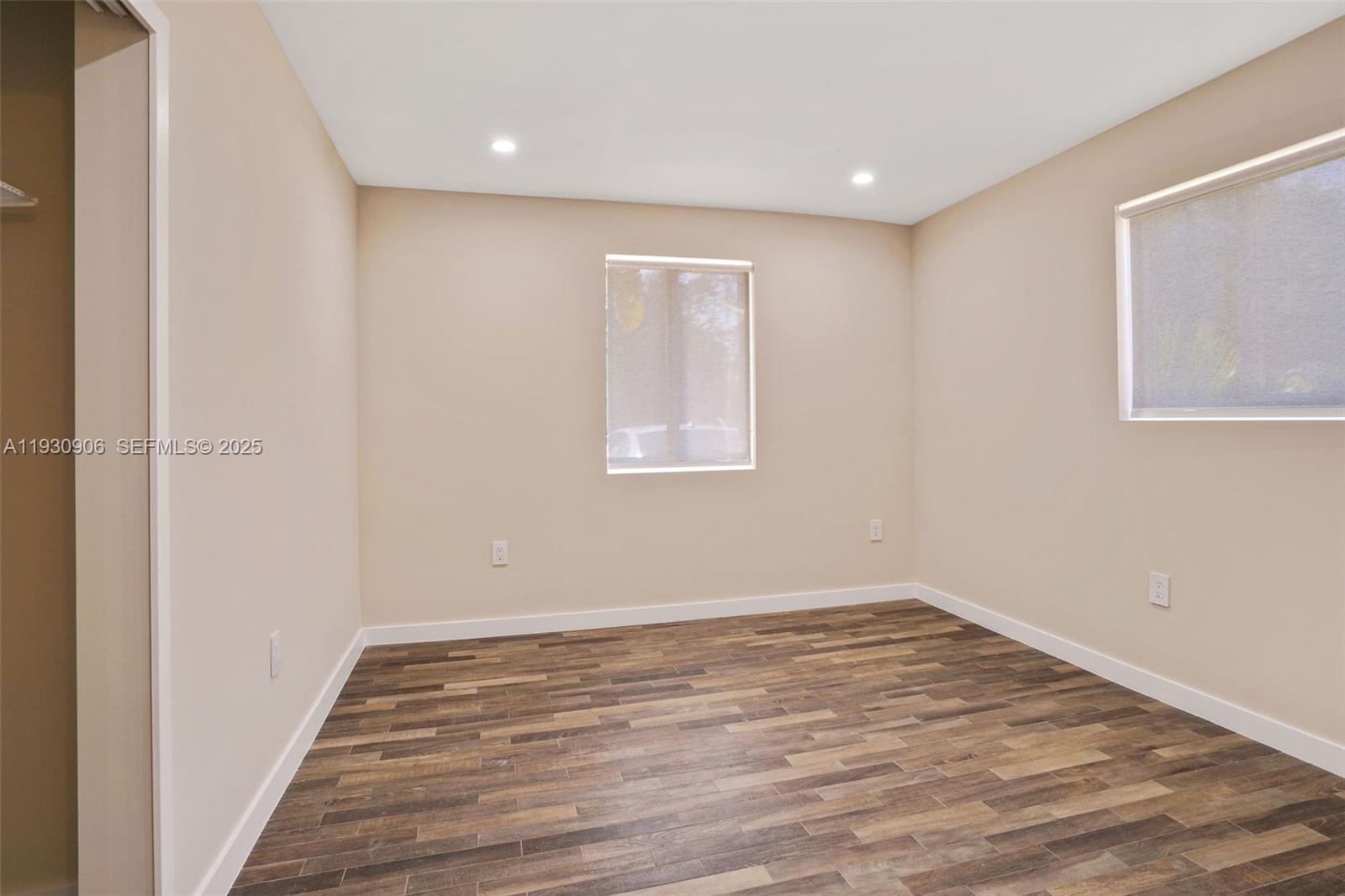 6701 Southwest 49th Terrace Miami, FL 33155 - Photo 28 of 35 a view of an empty room with wooden floor and a window