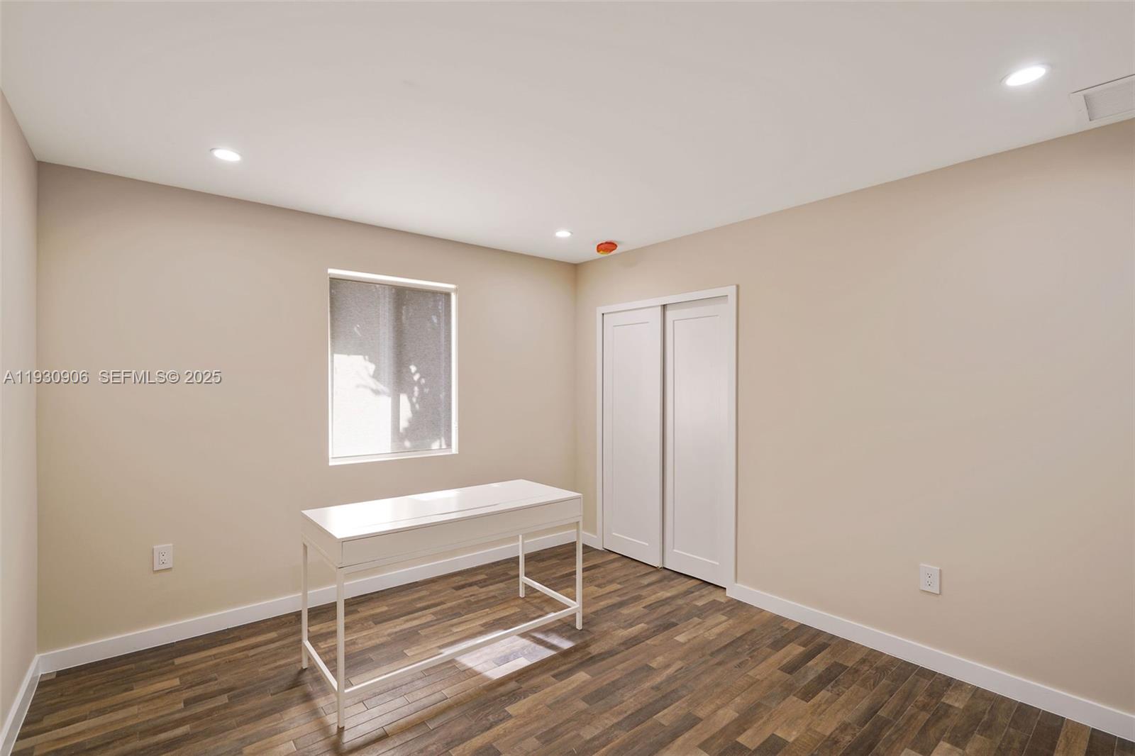 6701 Southwest 49th Terrace Miami, FL 33155 - Photo 33 of 35 a bedroom with a bed and a window