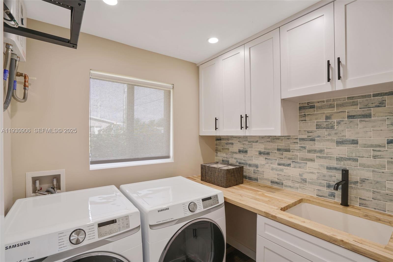 6701 Southwest 49th Terrace Miami, FL 33155 - Photo 35 of 35 a utility room with dryer and washer