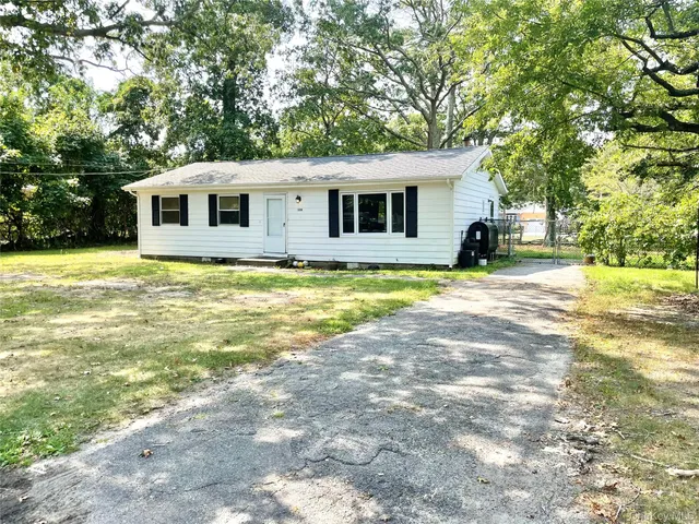 a view of a house with swimming pool and sitting area