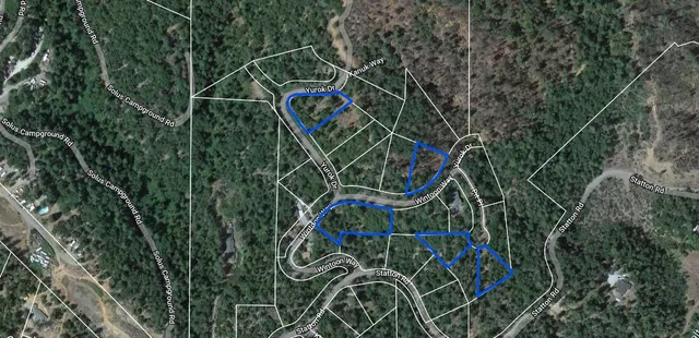 a view of an umbrella with wooden fence