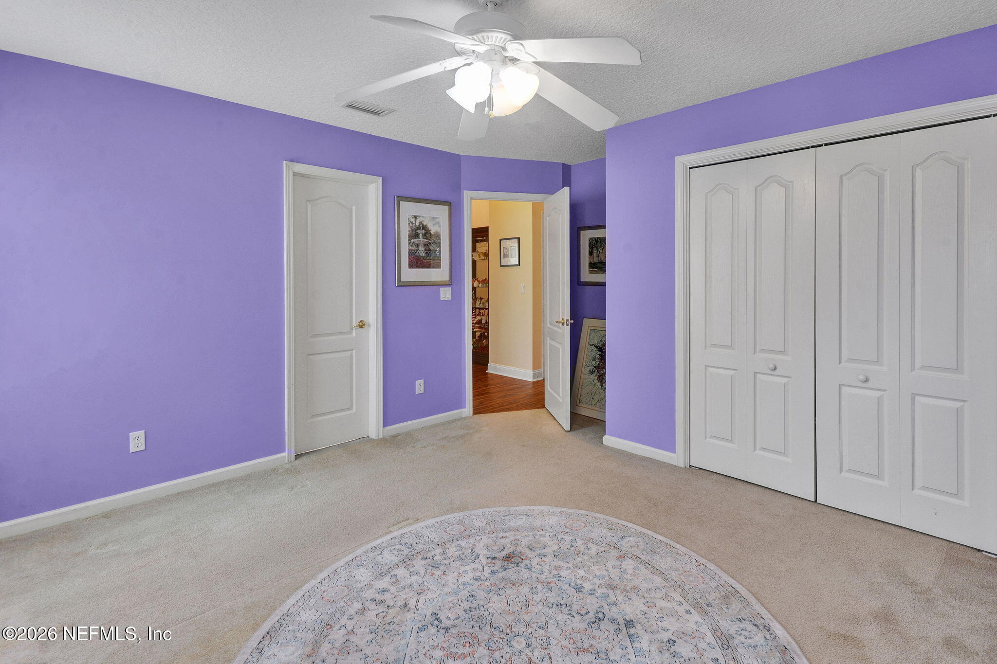 5950 West Shores Road Orange Park, FL 32003 - Photo 29 of 42 a view of a livingroom with a chandelier fan and a window