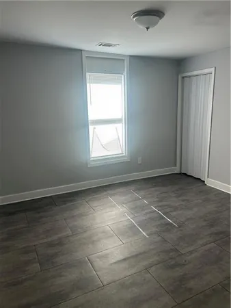 an empty room with a empty space and a window