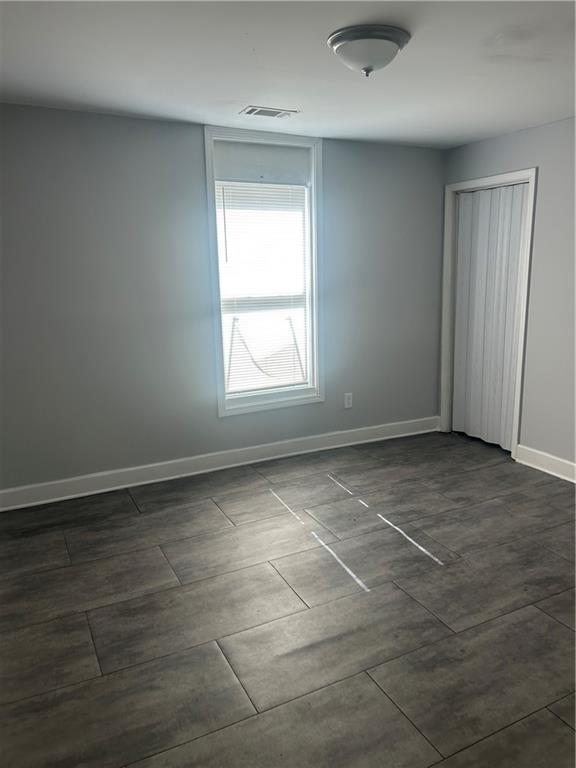 1180 Sims Street Southwest Atlanta, GA 30310 - Photo 3 of 12 an empty room with a empty space and a window