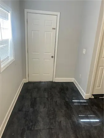 an empty room with wooden floor