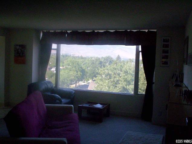 280 Island, Unit 1202 Reno, NV 89501 - Photo 4 of 4 a living room with furniture and a large window